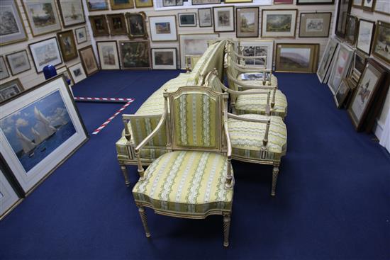 A suite of George III white and gilt seat furniture, comprising five armchairs and a settee, W.6ft 6in.